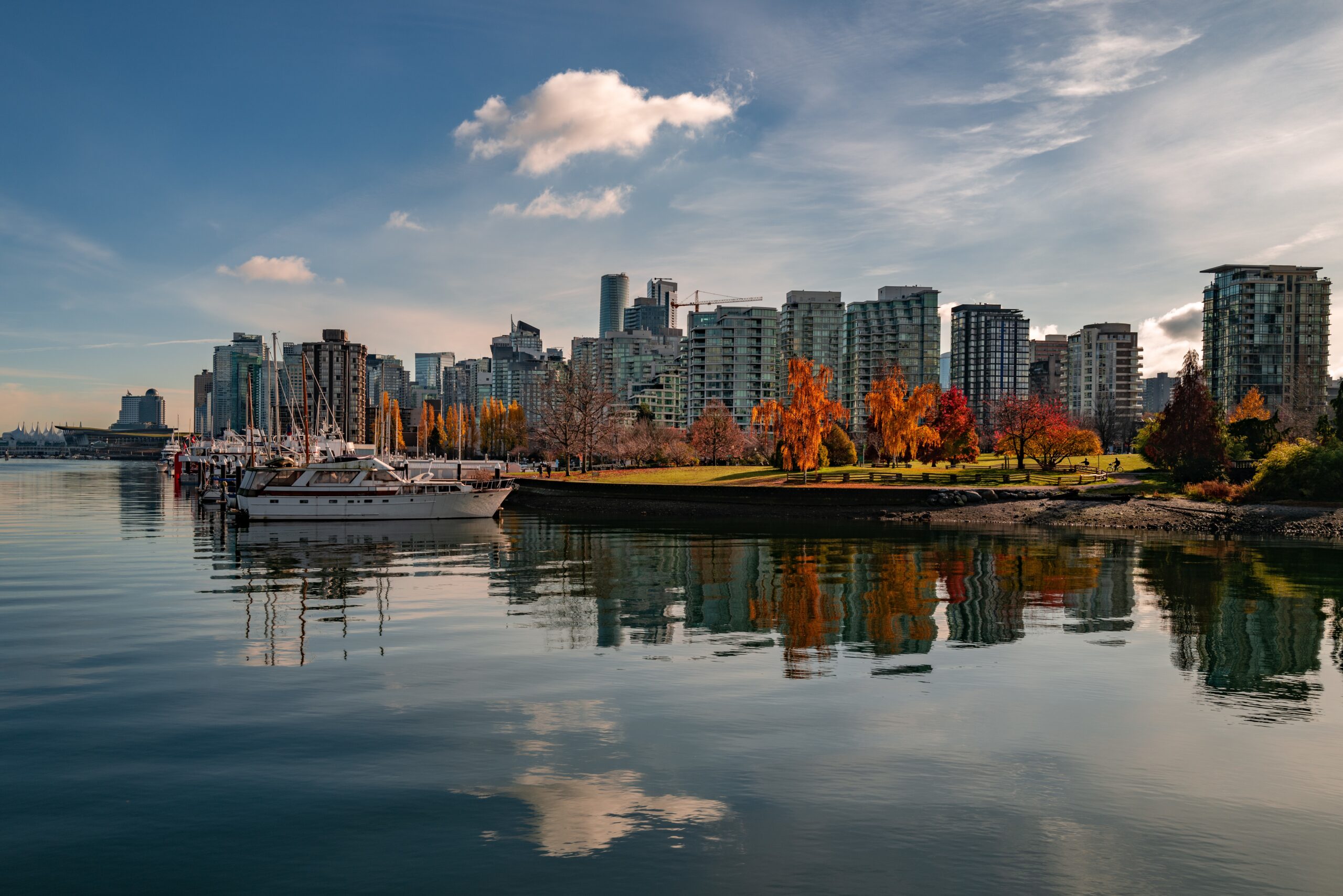 Beautiful shot of the boats parked near the Coal Harbour in Vancouver VANCOUVER, CANADA - Nov 13, 2019: A beautiful shot of the boats parked near the Coal Harbour in Vancouver